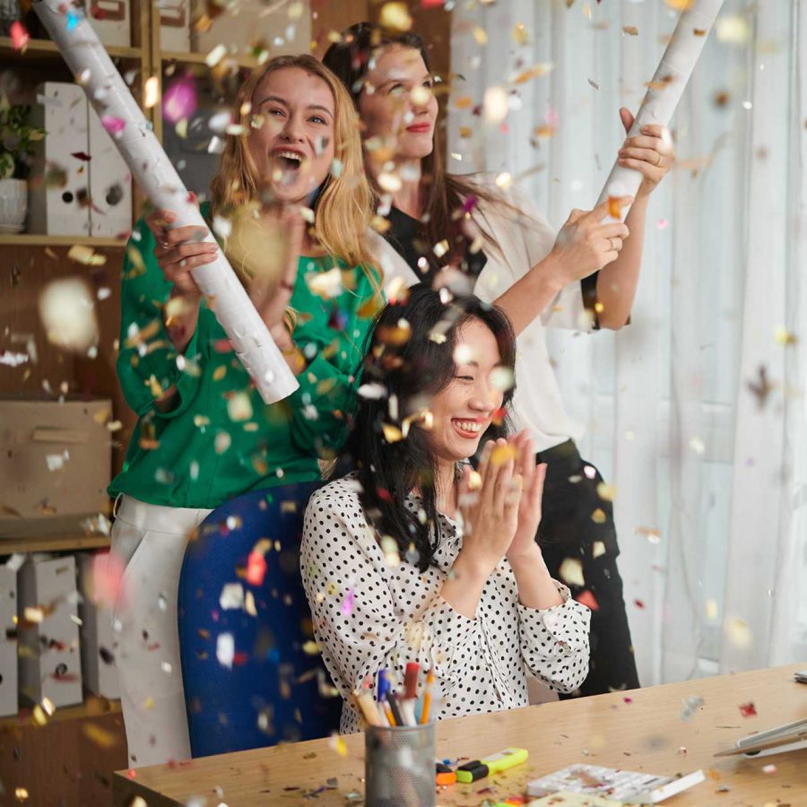 Colleagues Exploding Party Poppers